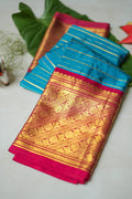 Turquoise Silk Saree with Gold Stripes: turquoise silk with gold zari stripes and a rani pink brocade pallu (folded)