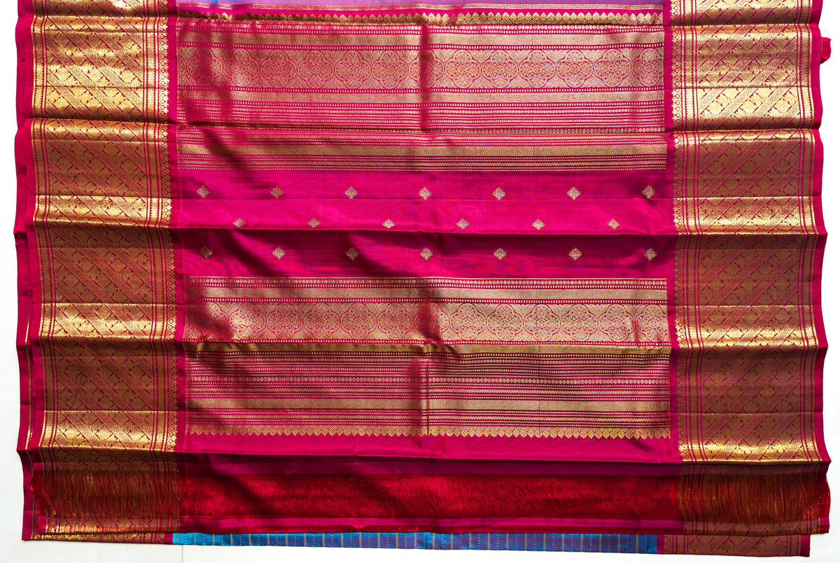 Turquoise Silk Saree with Gold Stripes: turquoise silk with gold zari stripes and a rani pink brocade pallu (laid flat)