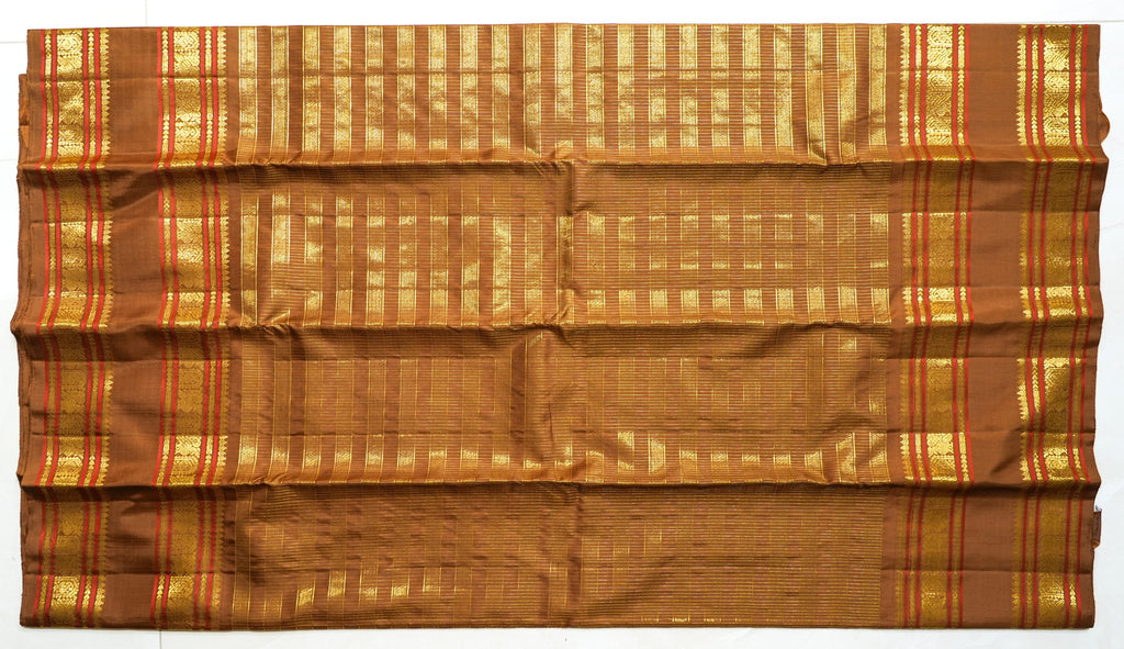 Brown Silk Saree with Copper Zari: chocolate-brown silk with a copper and gold zari border (laid flat)