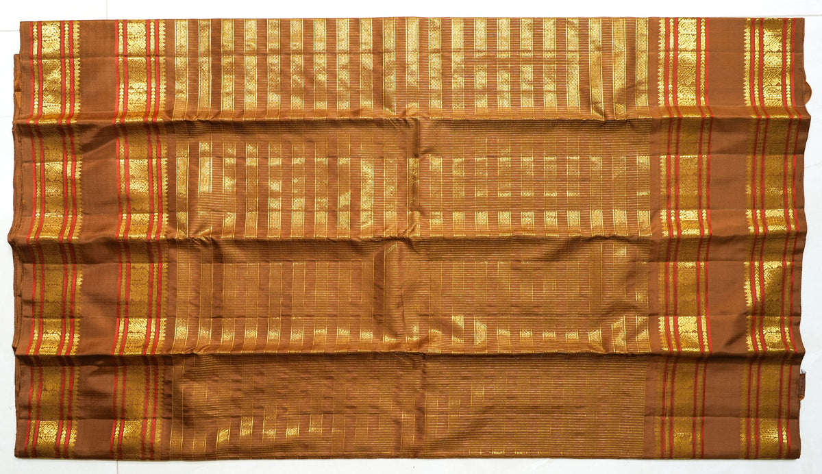 Brown Silk Saree with Copper Zari: chocolate-brown silk with a copper and gold zari border (laid flat)
