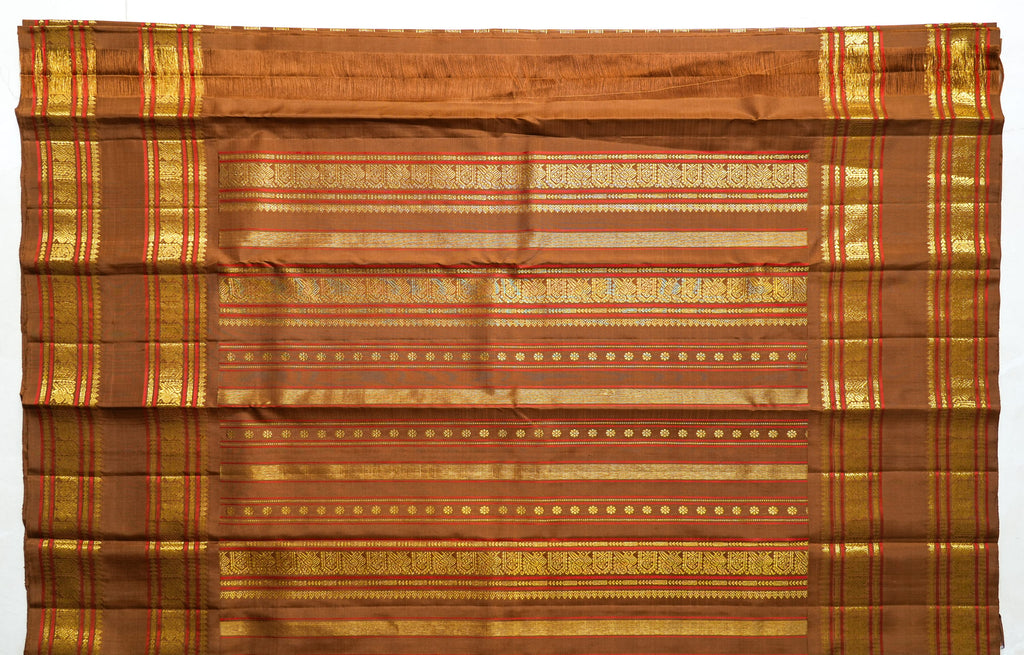 Brown Silk Saree with Copper Zari: chocolate-brown silk with a copper and gold zari border (laid flat)