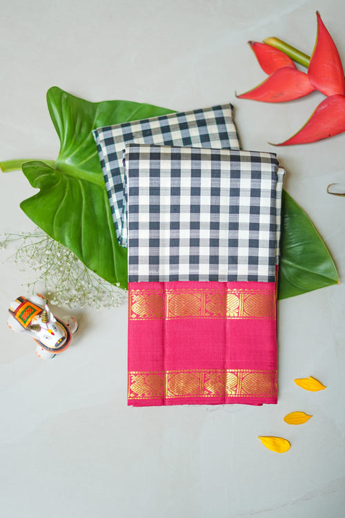 Chaduranga silk saree: ivory-and-ink checks, rani pink zari border (folded)