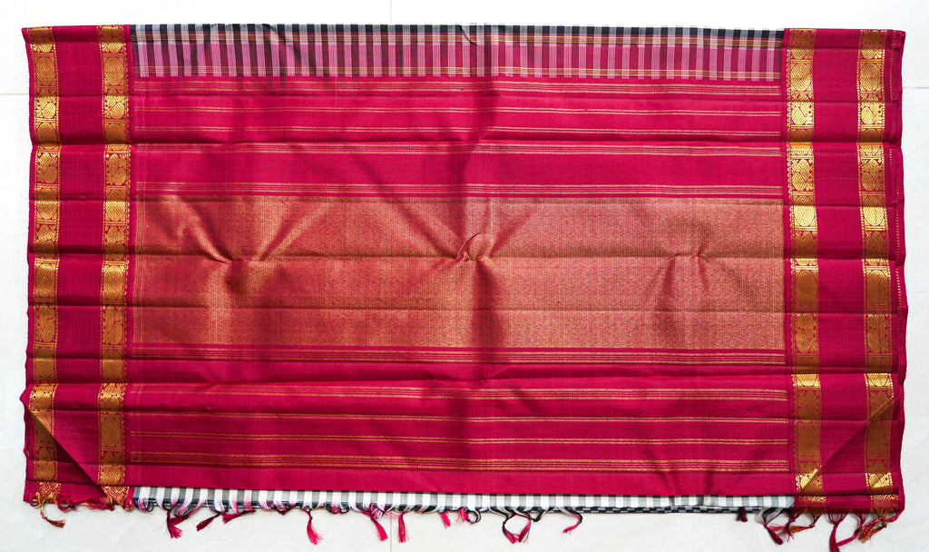 Chaduranga silk saree: ivory-and-ink checks, rani pink zari border (laid flat)