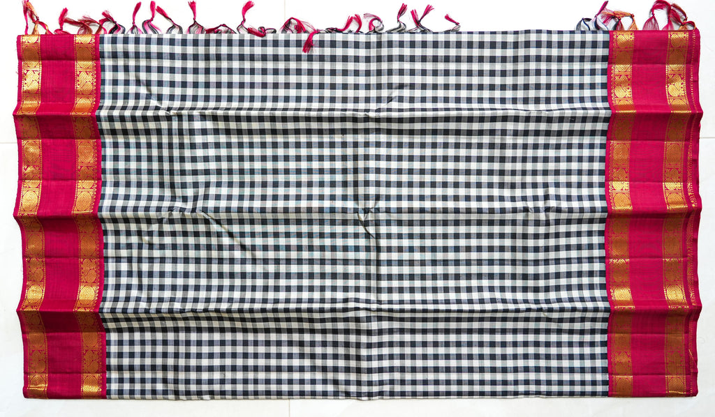 Chaduranga silk saree: ivory-and-ink checks, rani pink zari border (laid flat)