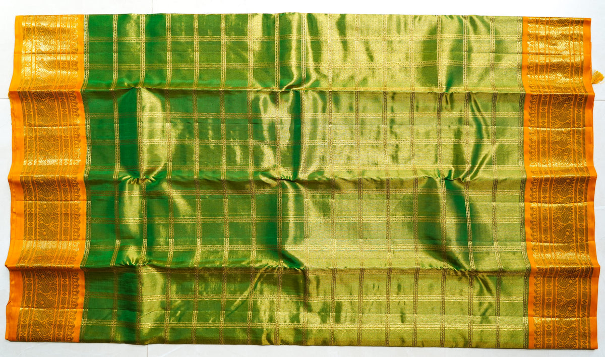 Green Silk Saree with Gold Checks: bottle-green silk with gold zari checks and a mustard border (laid flat)