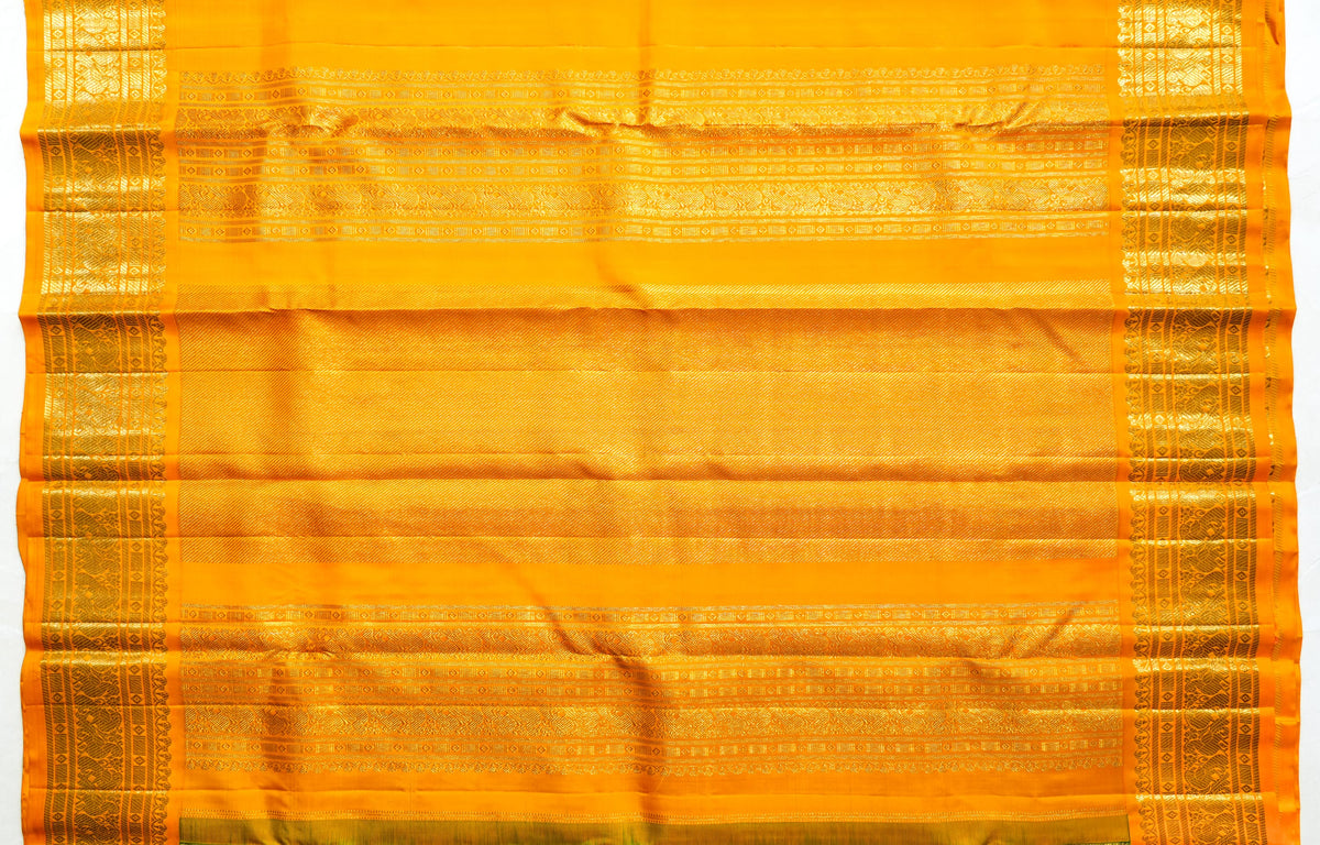 Green Silk Saree with Gold Checks: bottle-green silk with gold zari checks and a mustard border (laid flat)
