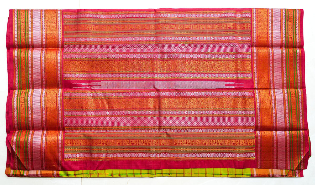 Haritha silk saree: parrot-green checks, red temple border (laid flat)