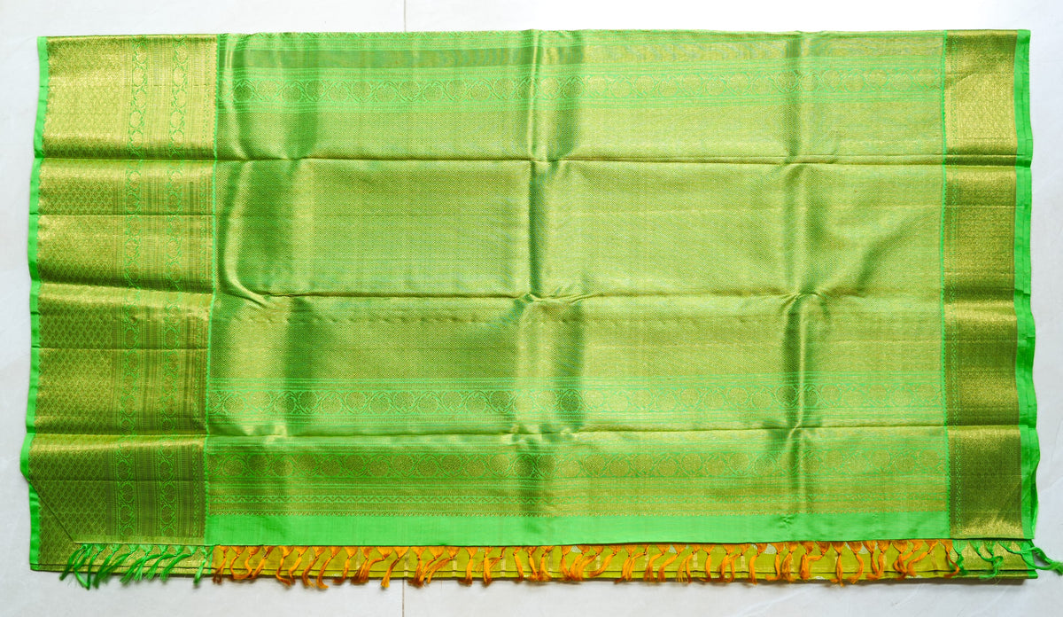 Lemon Yellow Silk Saree with Lime Green Border: lemon-yellow silk with gold butas and a lime-green zari border (laid flat)