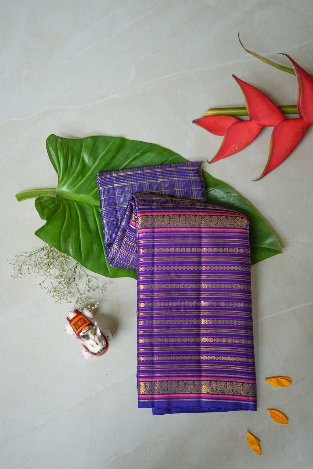 Neelambari silk saree: royal purple with gold zari stripes (folded)