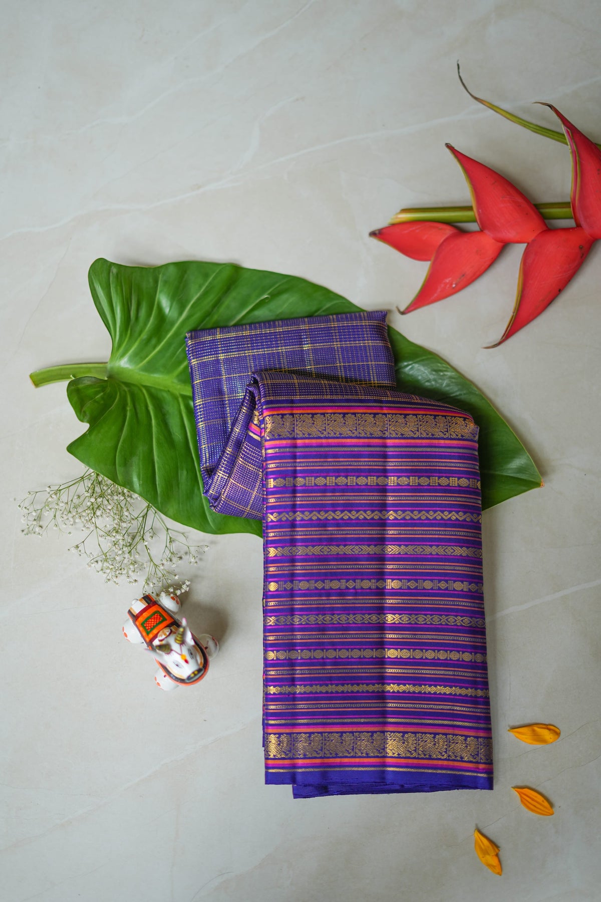 Neelambari silk saree: royal purple with gold zari stripes (folded)