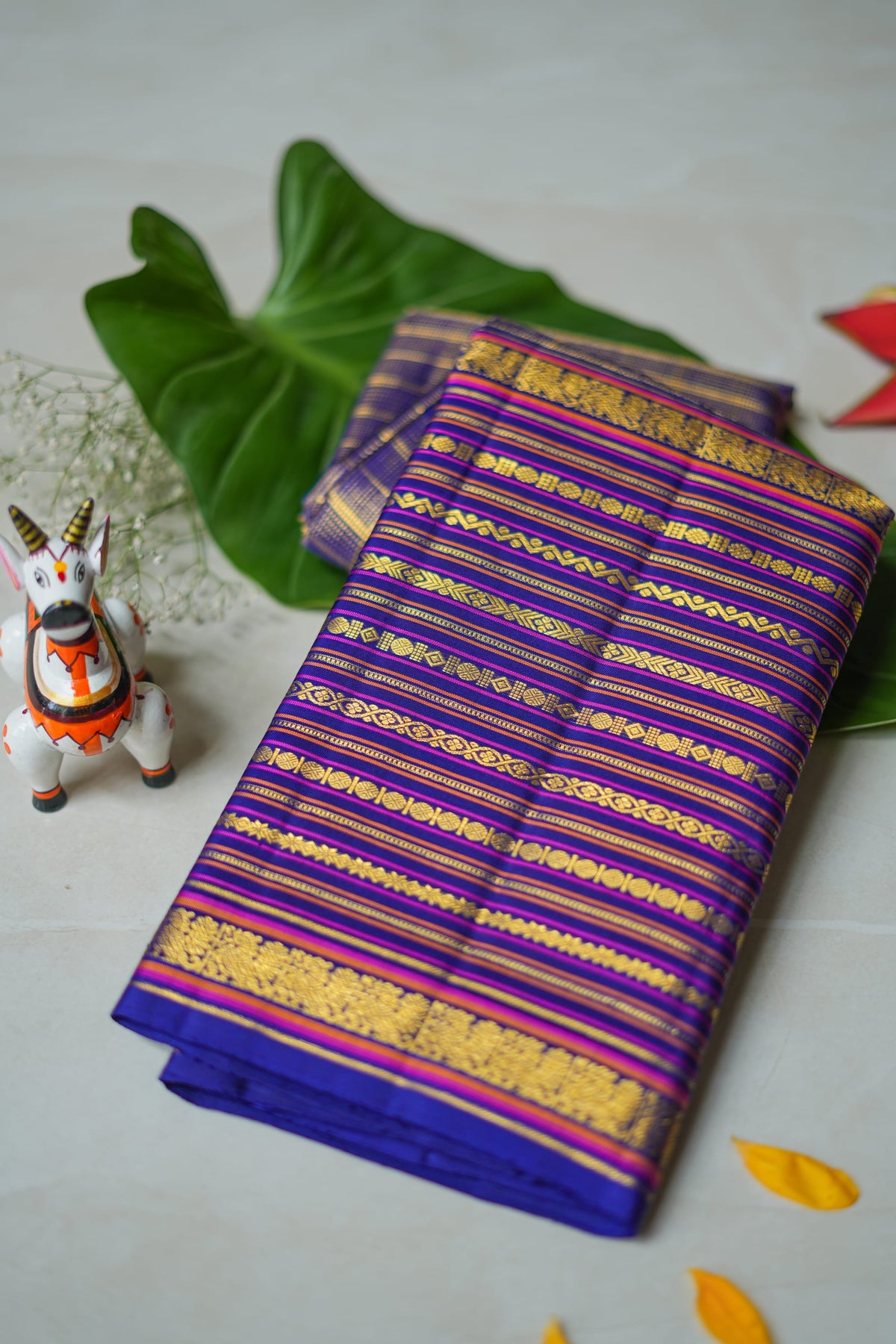 Neelambari silk saree: royal purple with gold zari stripes (folded)