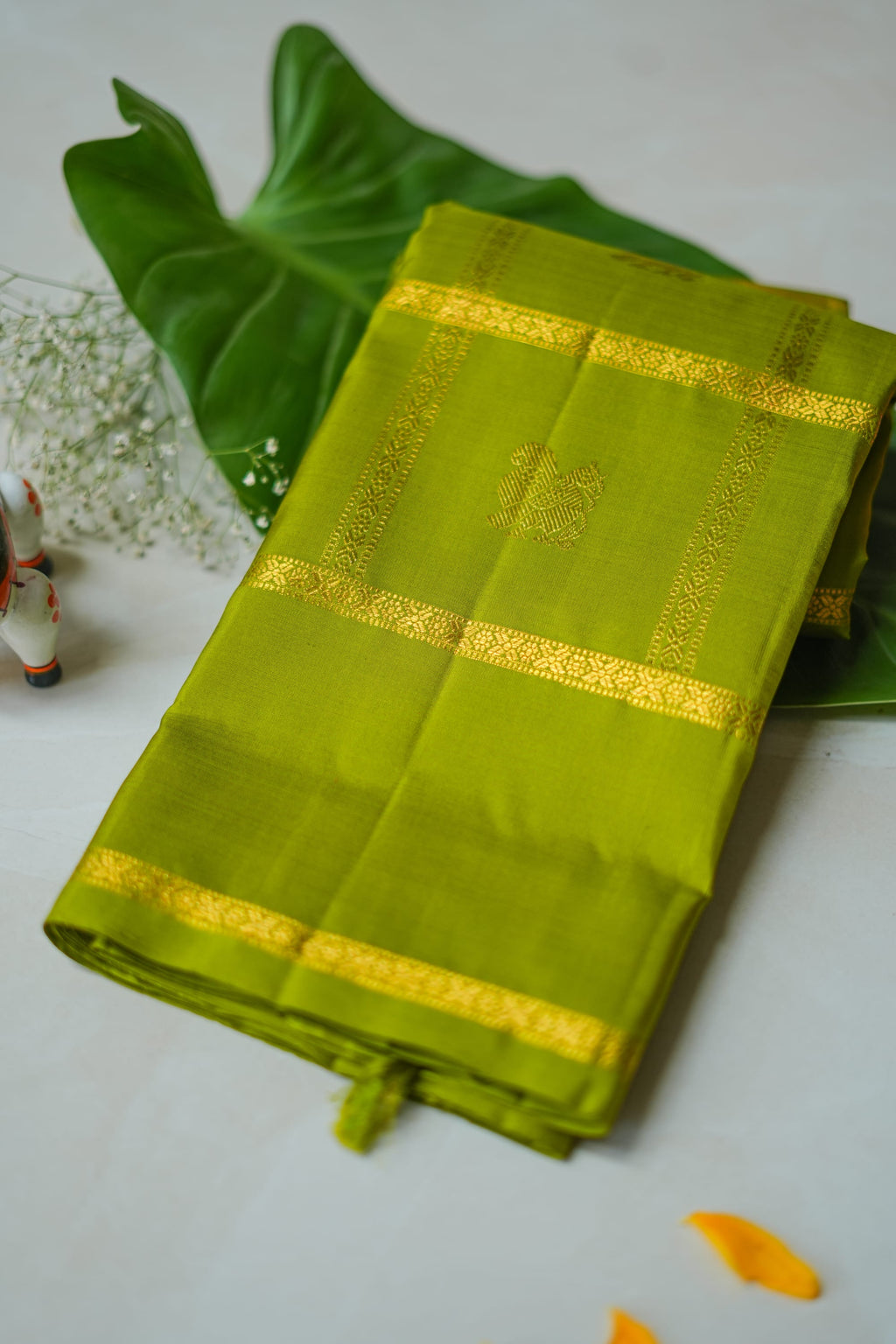 Olive Green Silk Saree with Gold Butas: olive-green silk with gold butas set in zari squares (folded)