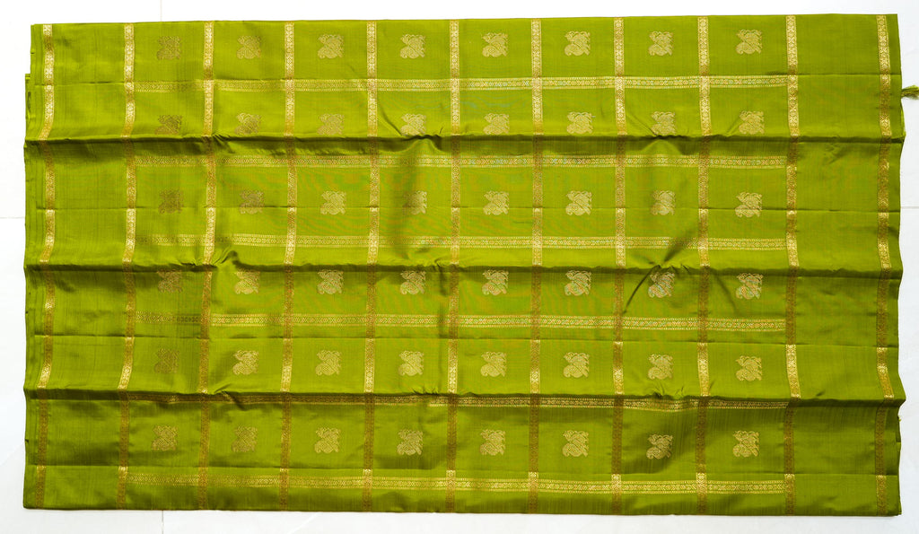 Olive Green Silk Saree with Gold Butas: olive-green silk with gold butas set in zari squares (laid flat)
