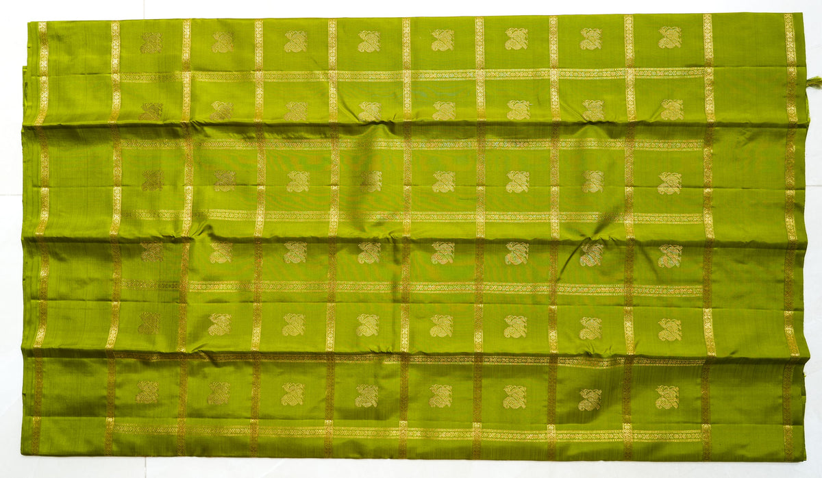 Olive Green Silk Saree with Gold Butas: olive-green silk with gold butas set in zari squares (laid flat)