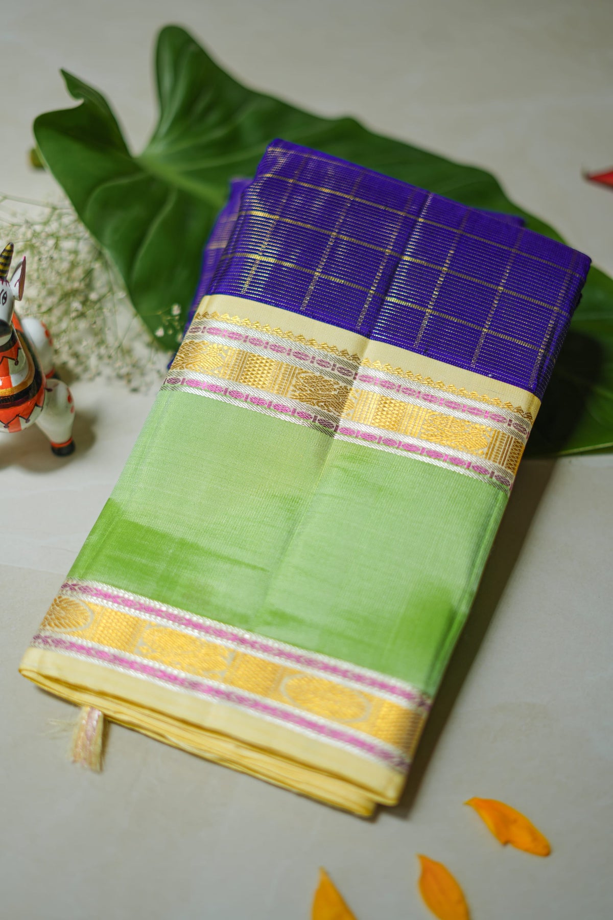 Purple Checked Silk Saree with Pistachio Border: purple zari checks with a pistachio-green border and a cream pallu (folded)