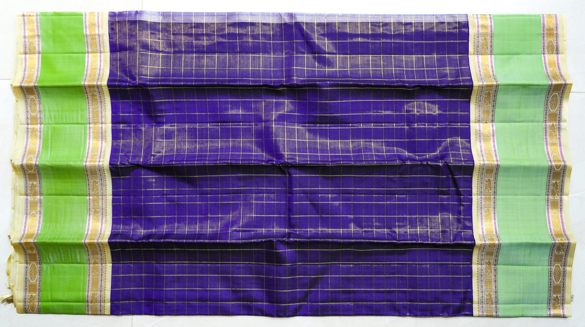 Purple Checked Silk Saree with Pistachio Border: purple zari checks with a pistachio-green border and a cream pallu (laid flat)