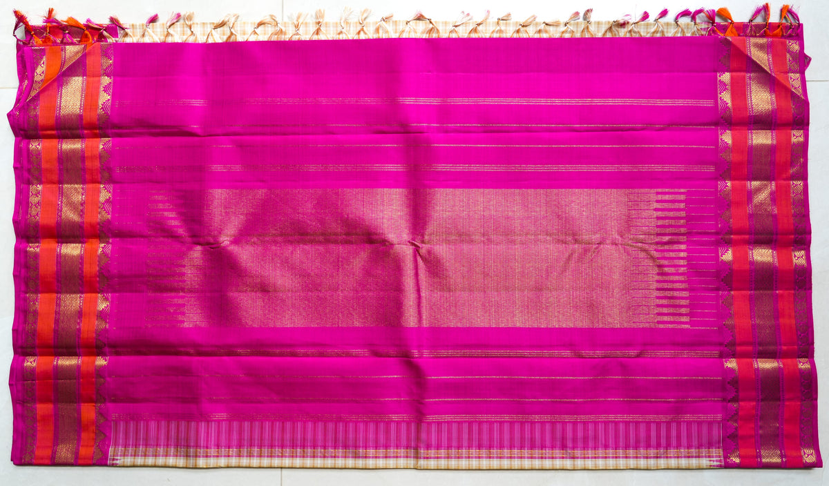 Sandhya silk saree: cream checks, coral and rani pink border (laid flat)