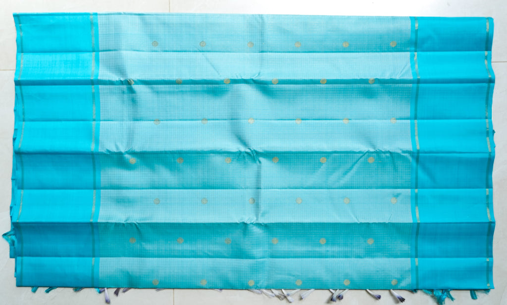 Sky Blue Silk Saree: sky-blue silk with tiny gold butas and fine zari lines (laid flat)