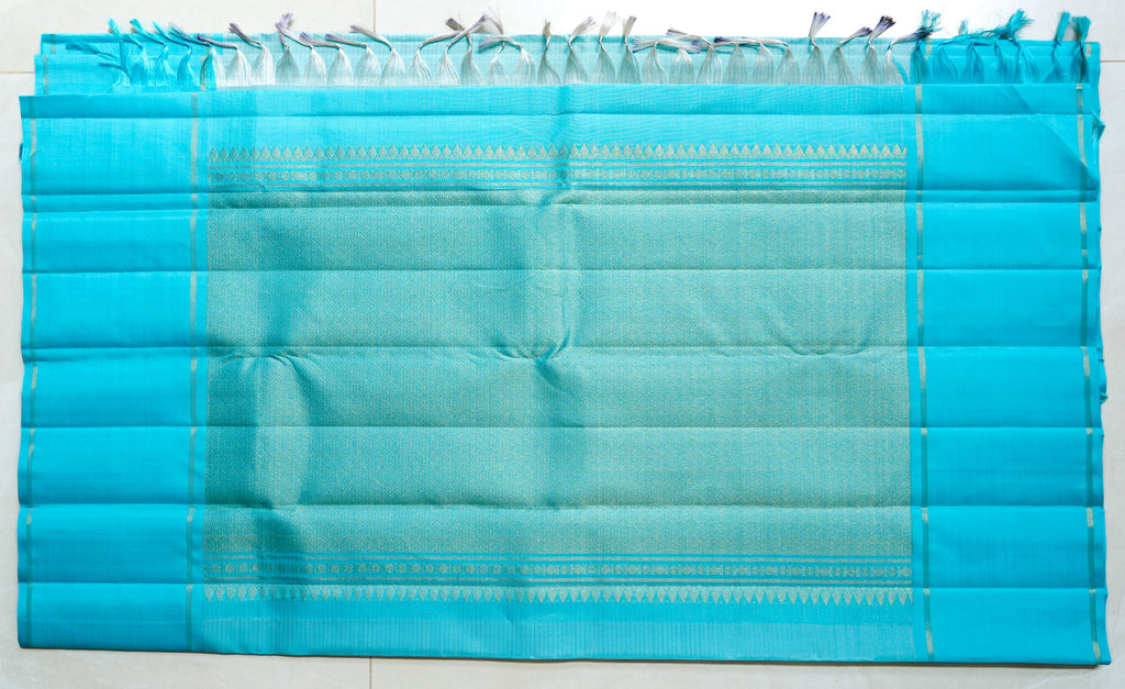 Sky Blue Silk Saree: sky-blue silk with tiny gold butas and fine zari lines (laid flat)