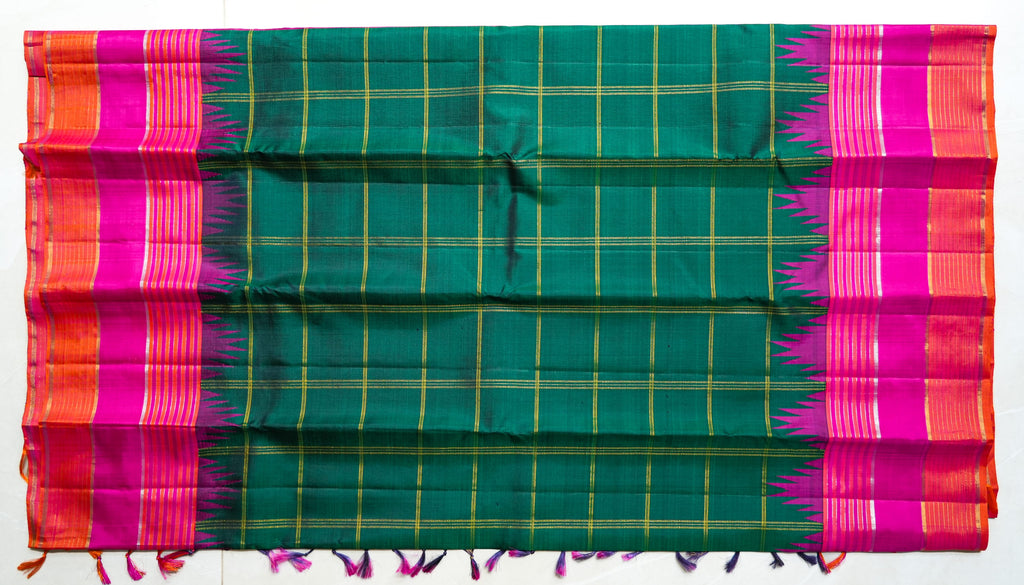 Teal Checked Silk Saree with Pink Temple Border: teal-green zari checks with a rani pink temple border and an orange edge (laid flat)