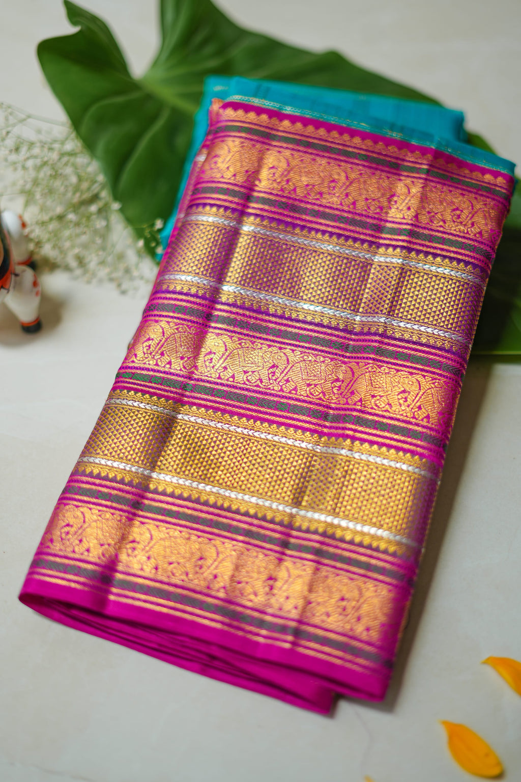 Utsava silk saree: rani pink with gold brocade stripes (folded)